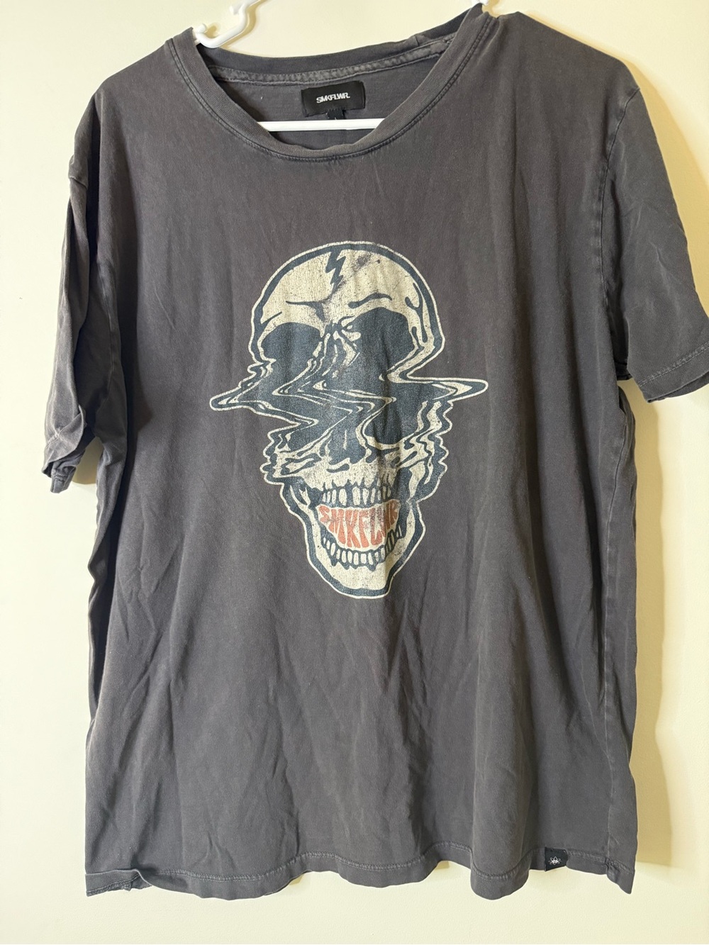 Black Short-Sleeve Tee with Distorted Skull Graphic